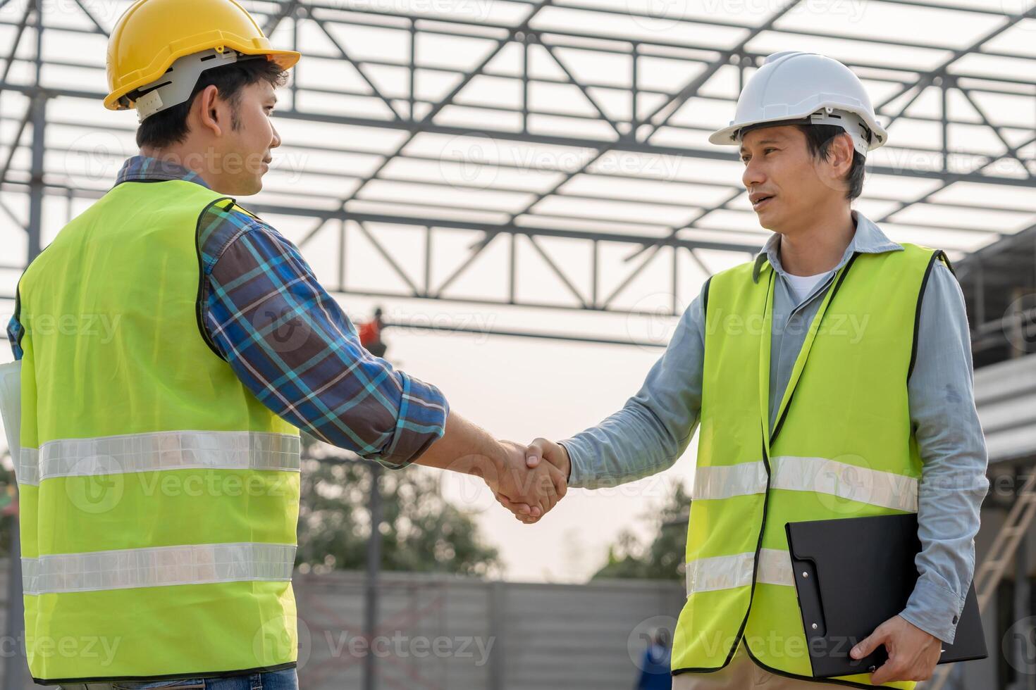 Construction team hands shaking greeting start up plan new project contract in office center at construction site, industry ,architecture, partner, teamwork, agreement, property contact photo