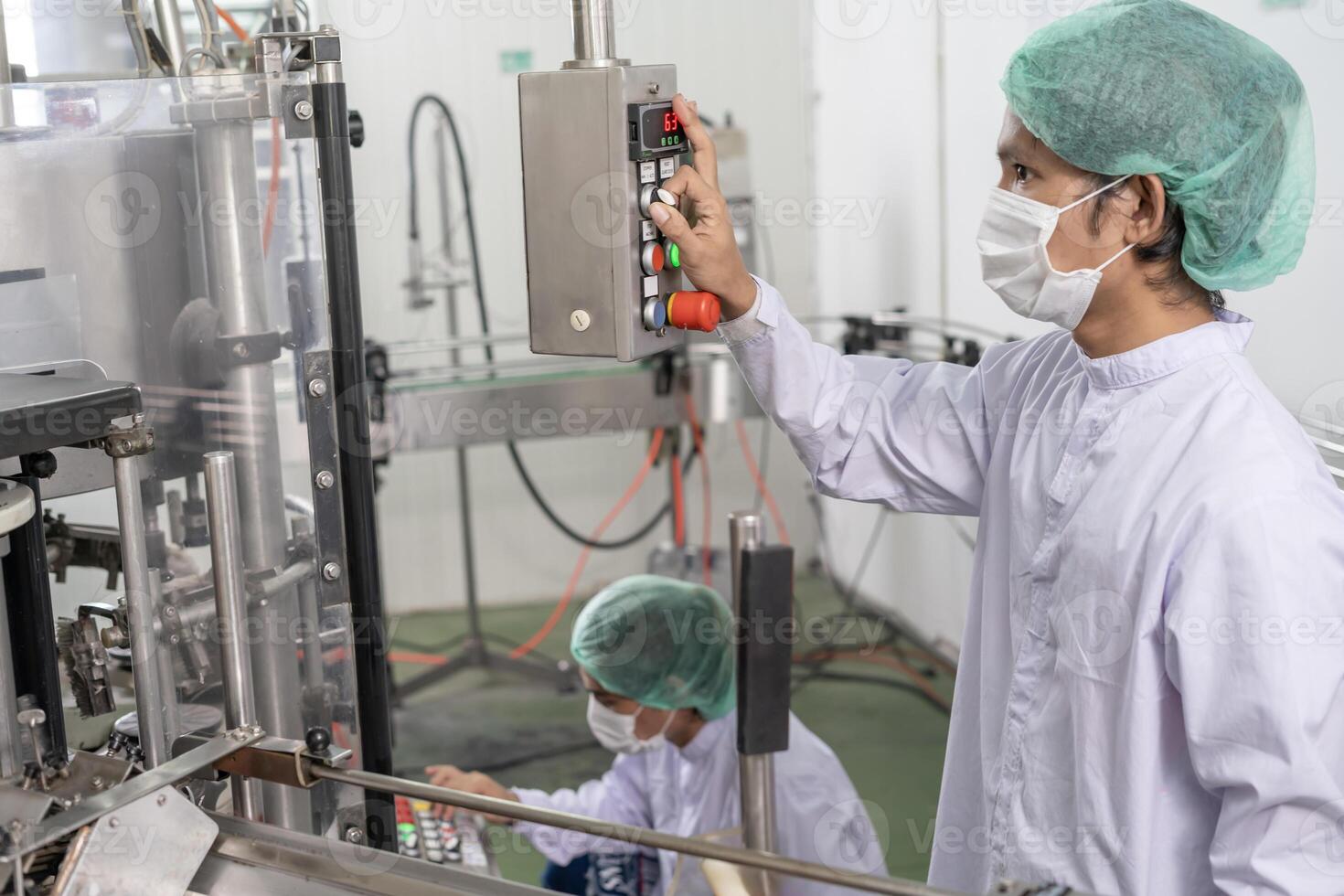 quality supervisor of food or beverages technician change parameter and condition control food or beverages before send product to the customer. Production leader recheck machine and productivity. photo