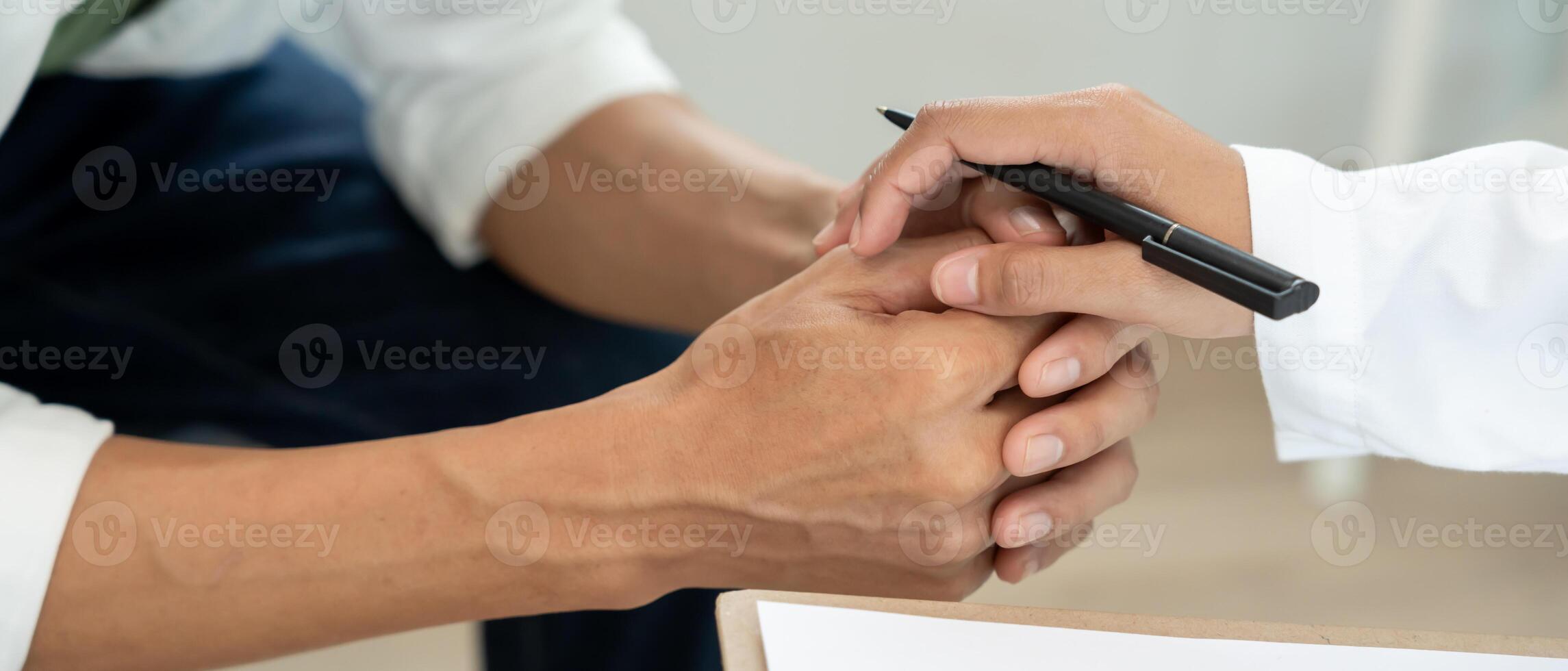 psychiatrist hold hand support each while discussing family issues. doctor encourages and empathy man suffers depression. psychological, save divorce, Hand in hand together. photo