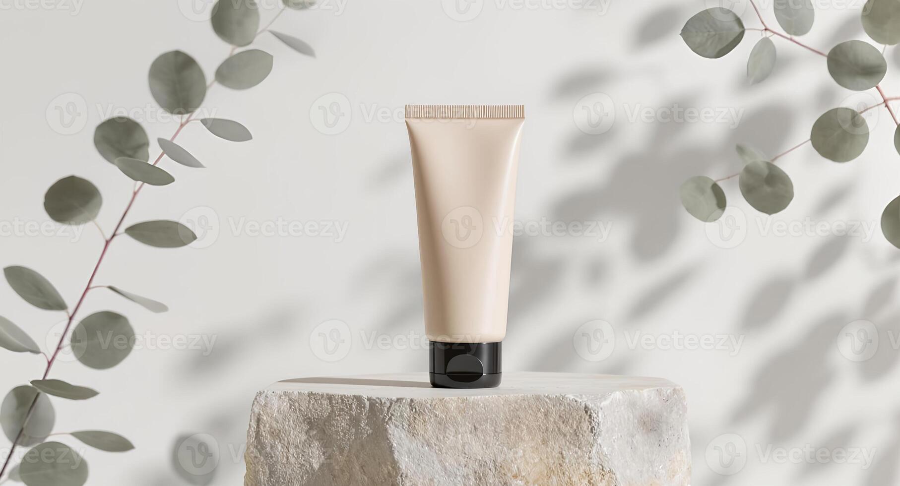 A tube of cream on a stone base with eucalyptus leaves photo