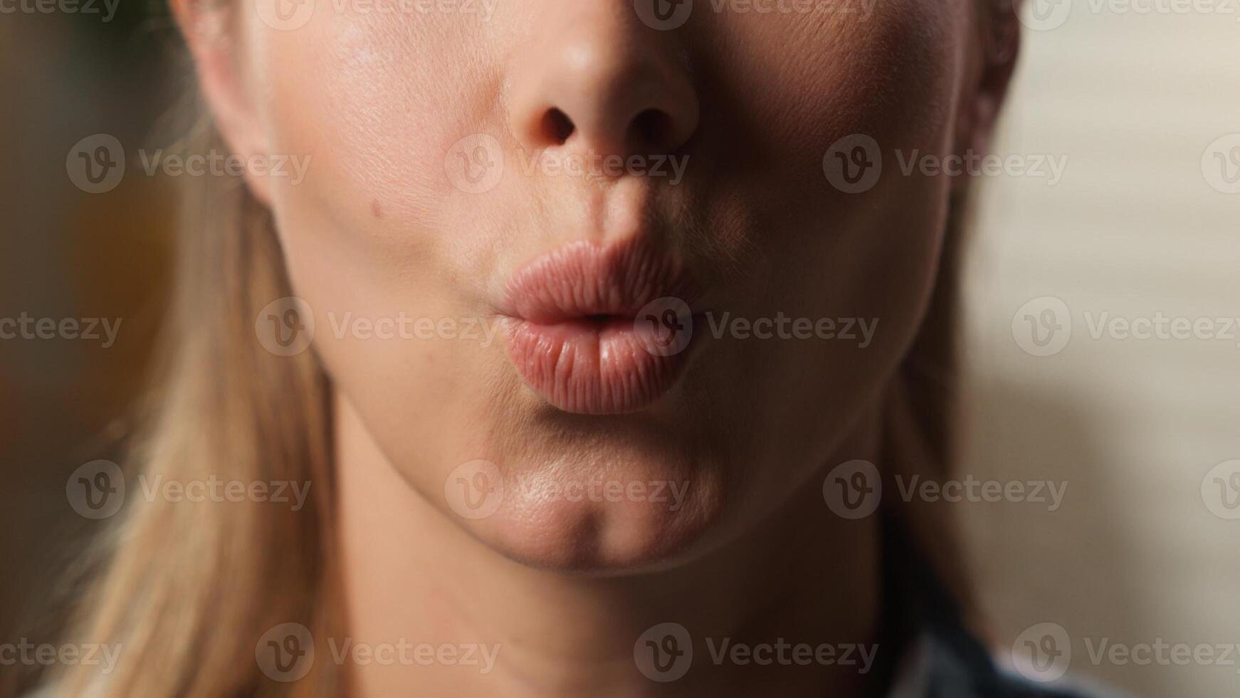 Cropped macro view close up unrecognizable Caucasian woman saying wow excited amazing news reaction astonish girl female lips mouth surprise half face indoors at home kissing lip kiss balm lipstick photo