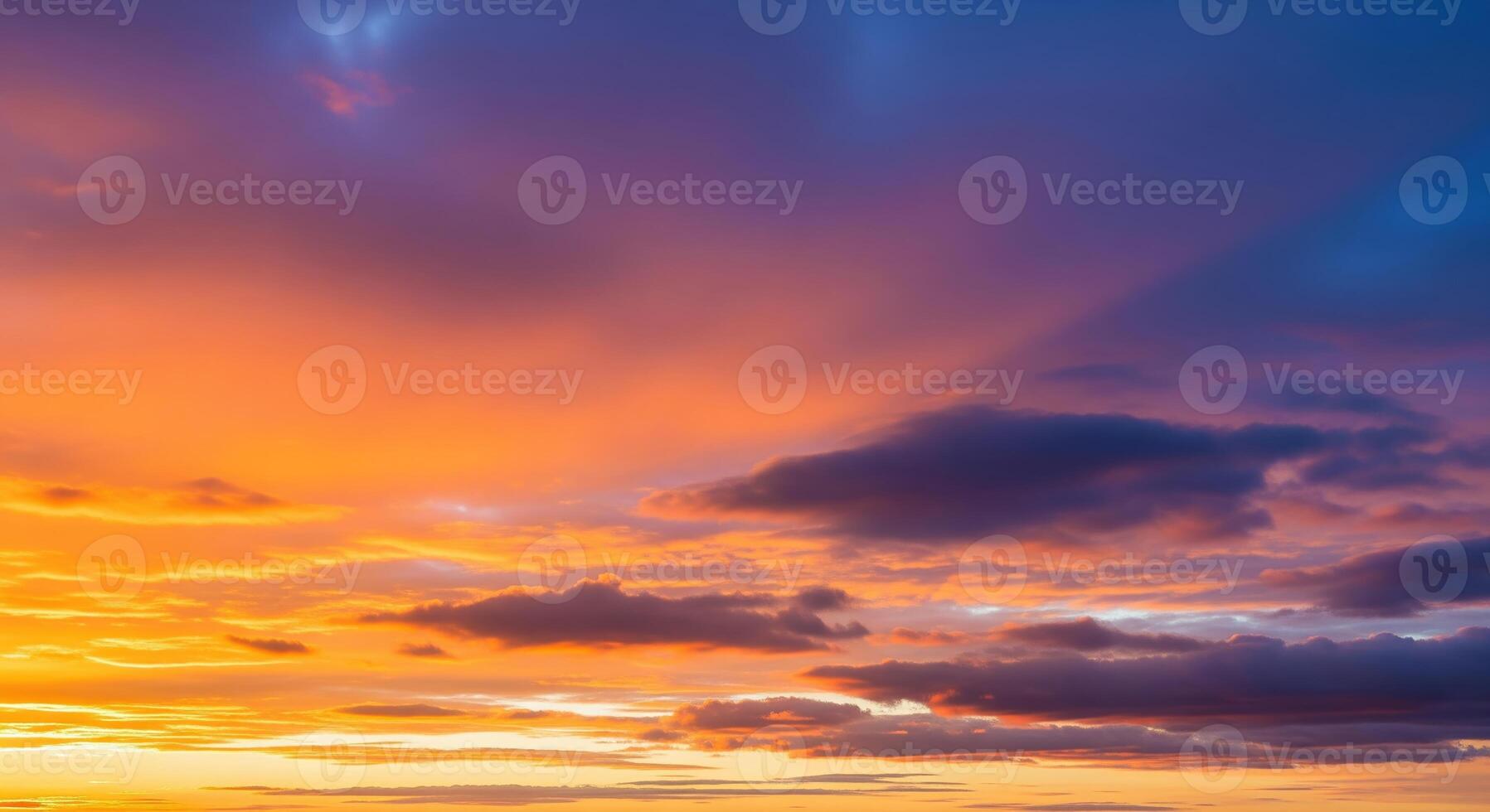 colorful sunset sky panorama with pink orange and yellow clouds photo