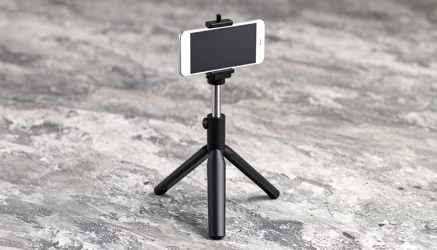 Smartphone Tripod on Concrete Slab photo