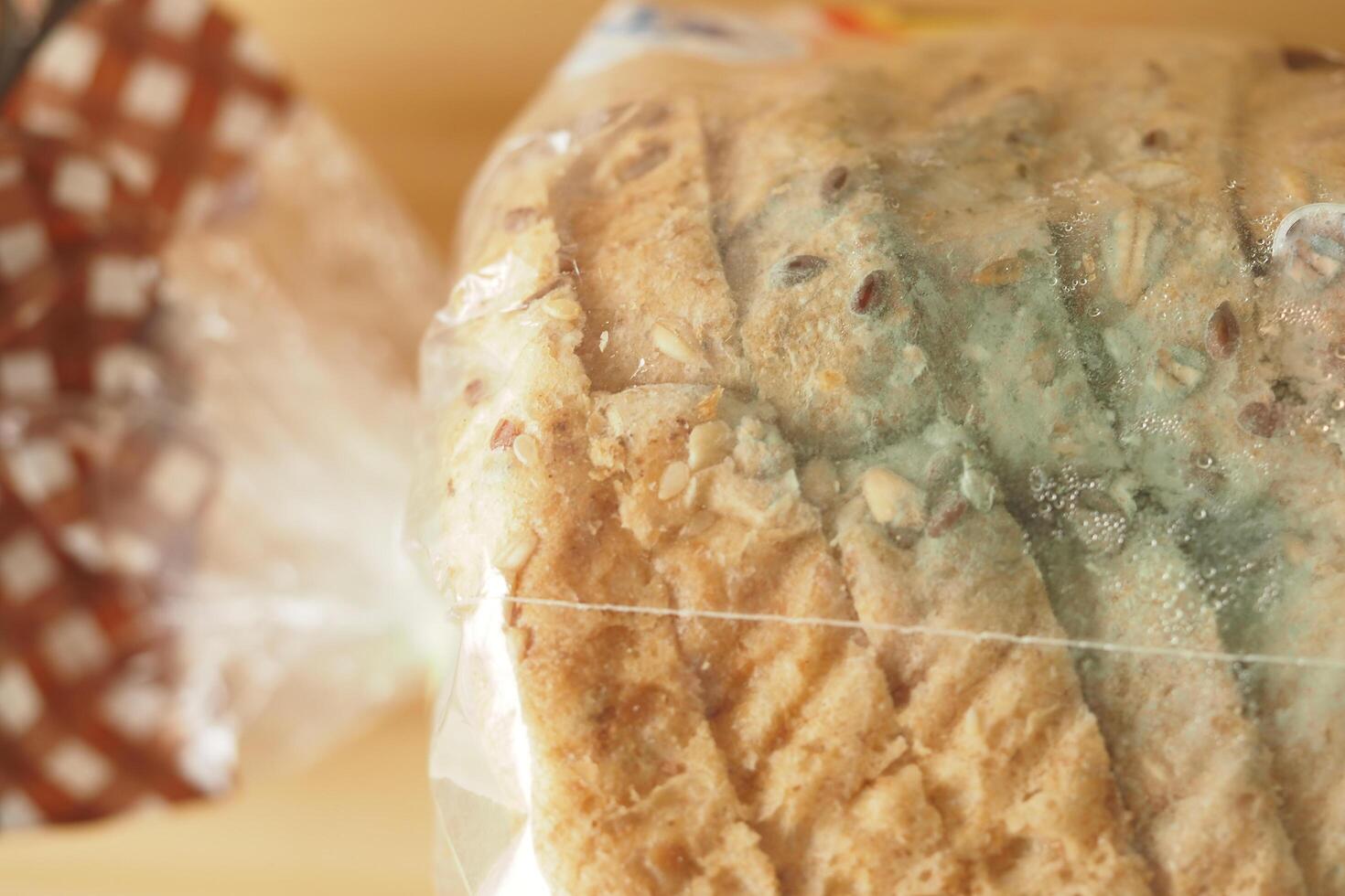 mold bread in a packet on a table photo
