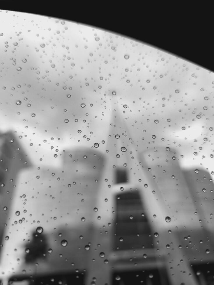 a view of a building through the windshield of a car photo