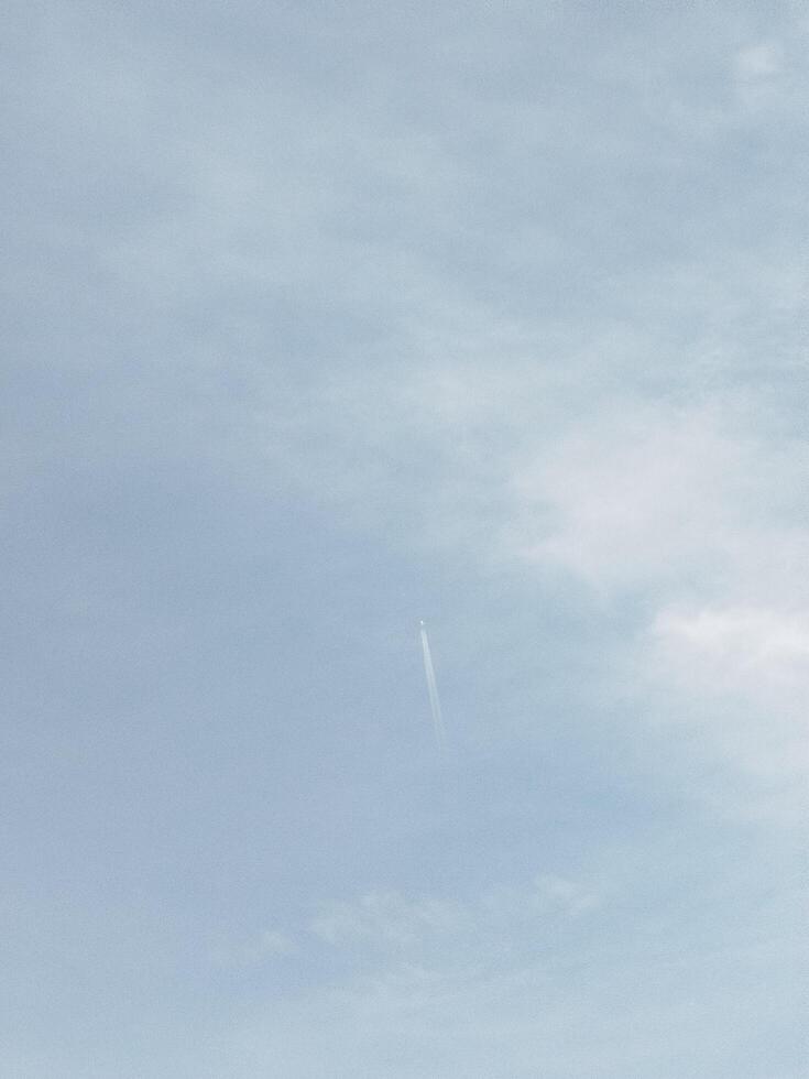 A man is flying a kite in the sky photo