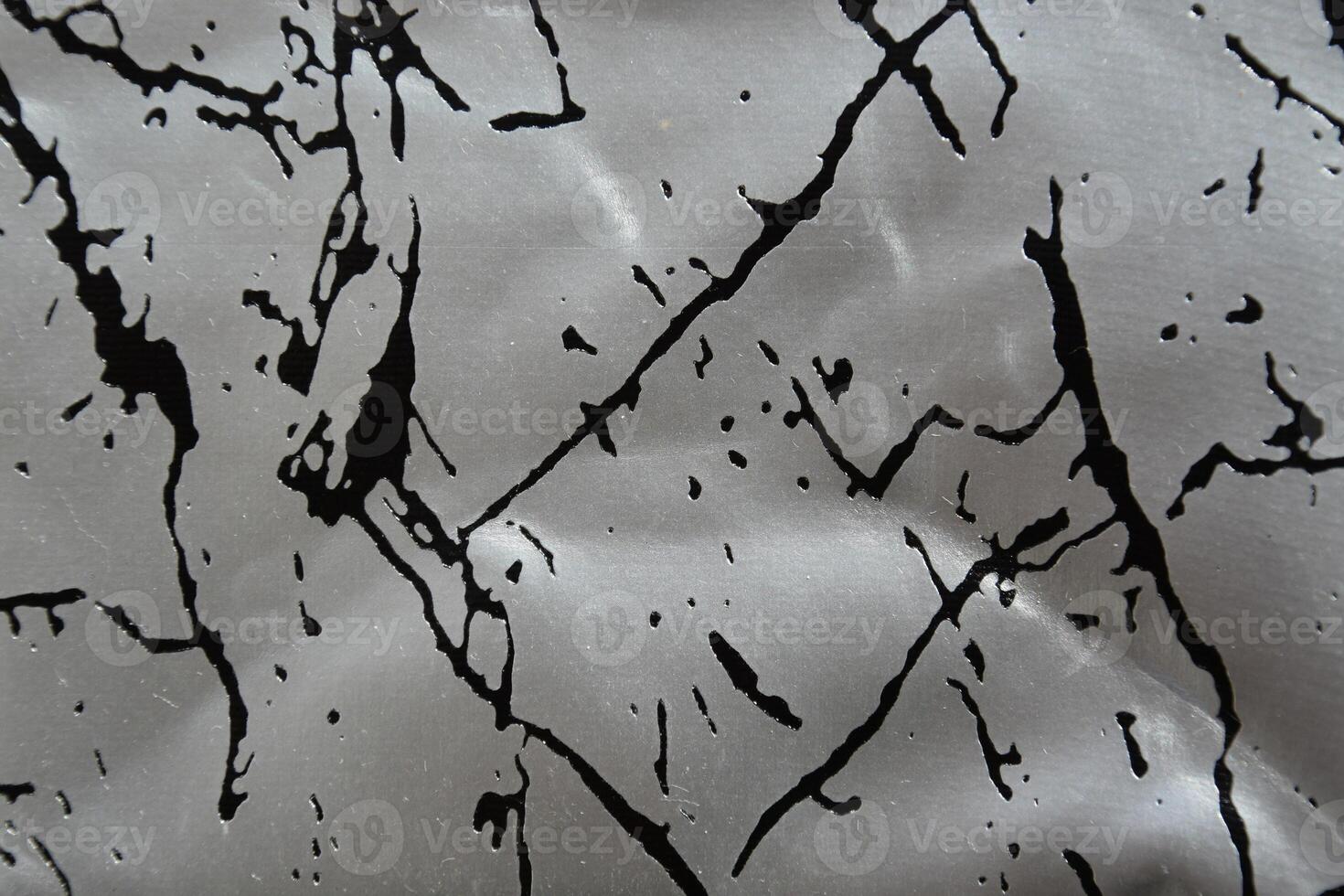 Closeup artificial leather silver color with black pattern for texture background photo