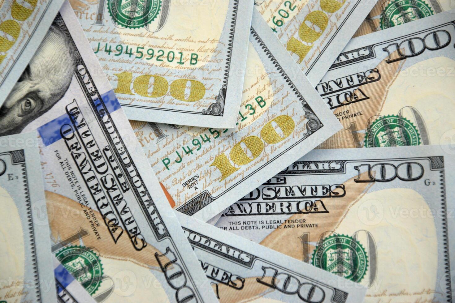 Pile of new one hundred dollar bills photo