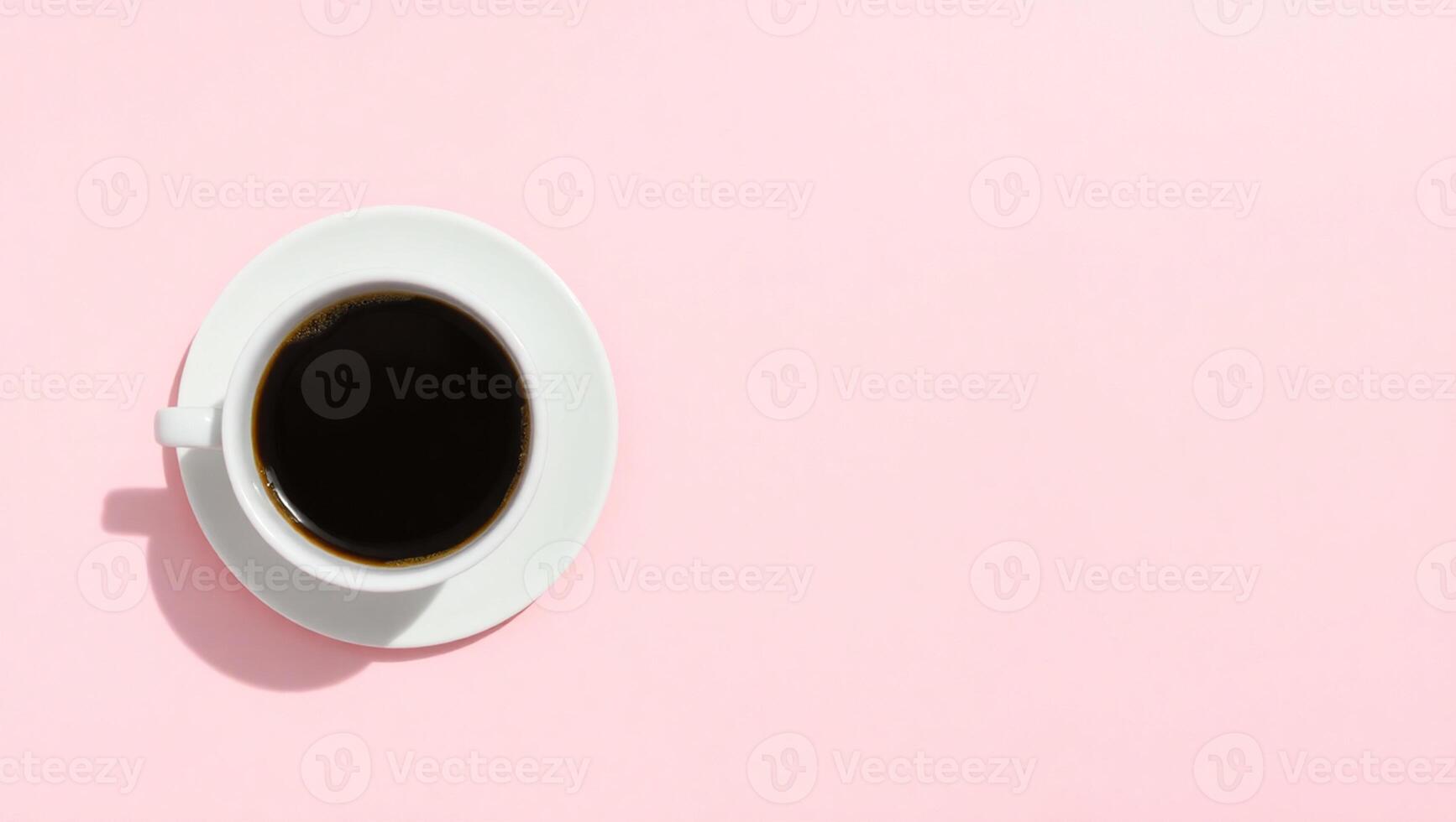 A top down view of a white cup of black coffee with rich crema placed photo