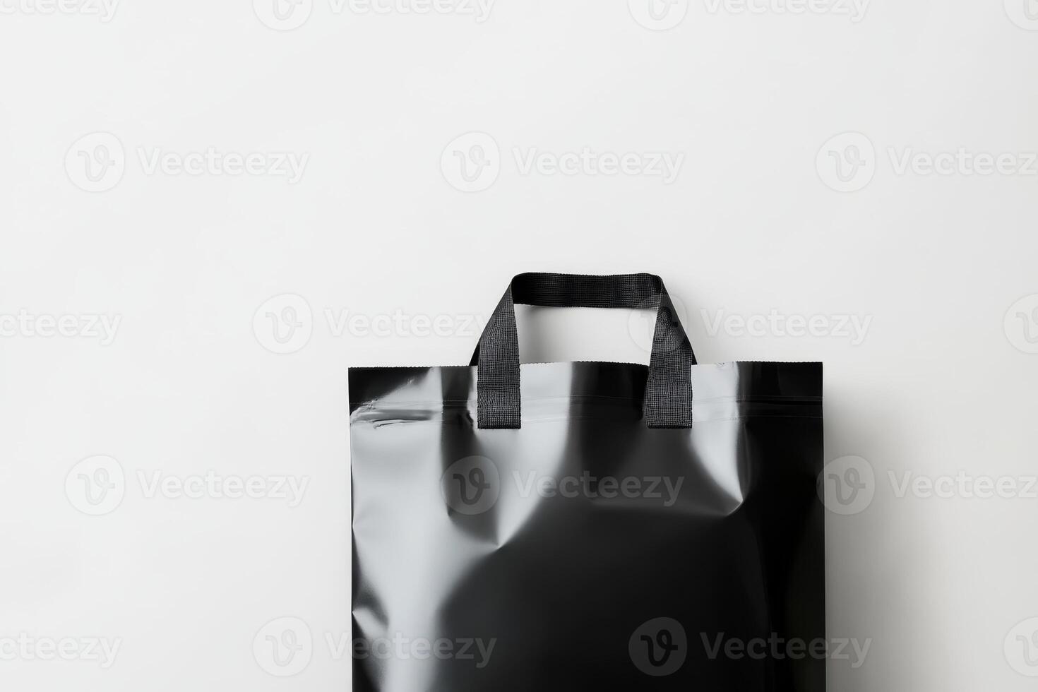 Black reusable shopping bag on a clean white background suitable for eco-friendly themes and product displays photo