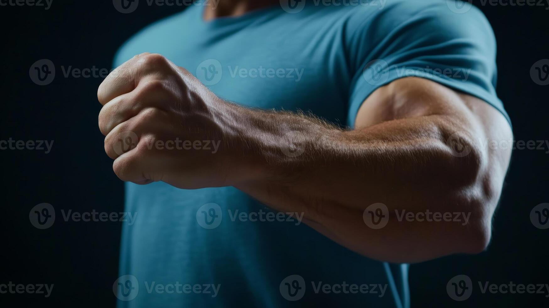 Muscular male fist flexing against dark background showcasing strength and determination photo