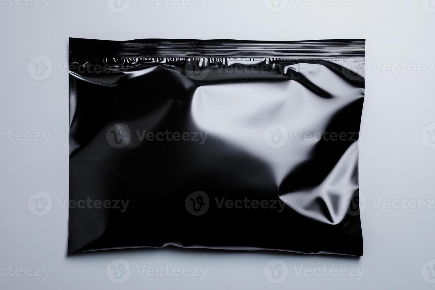 Black sealed packaging bag on a neutral background ideal for product display or branding purposes photo