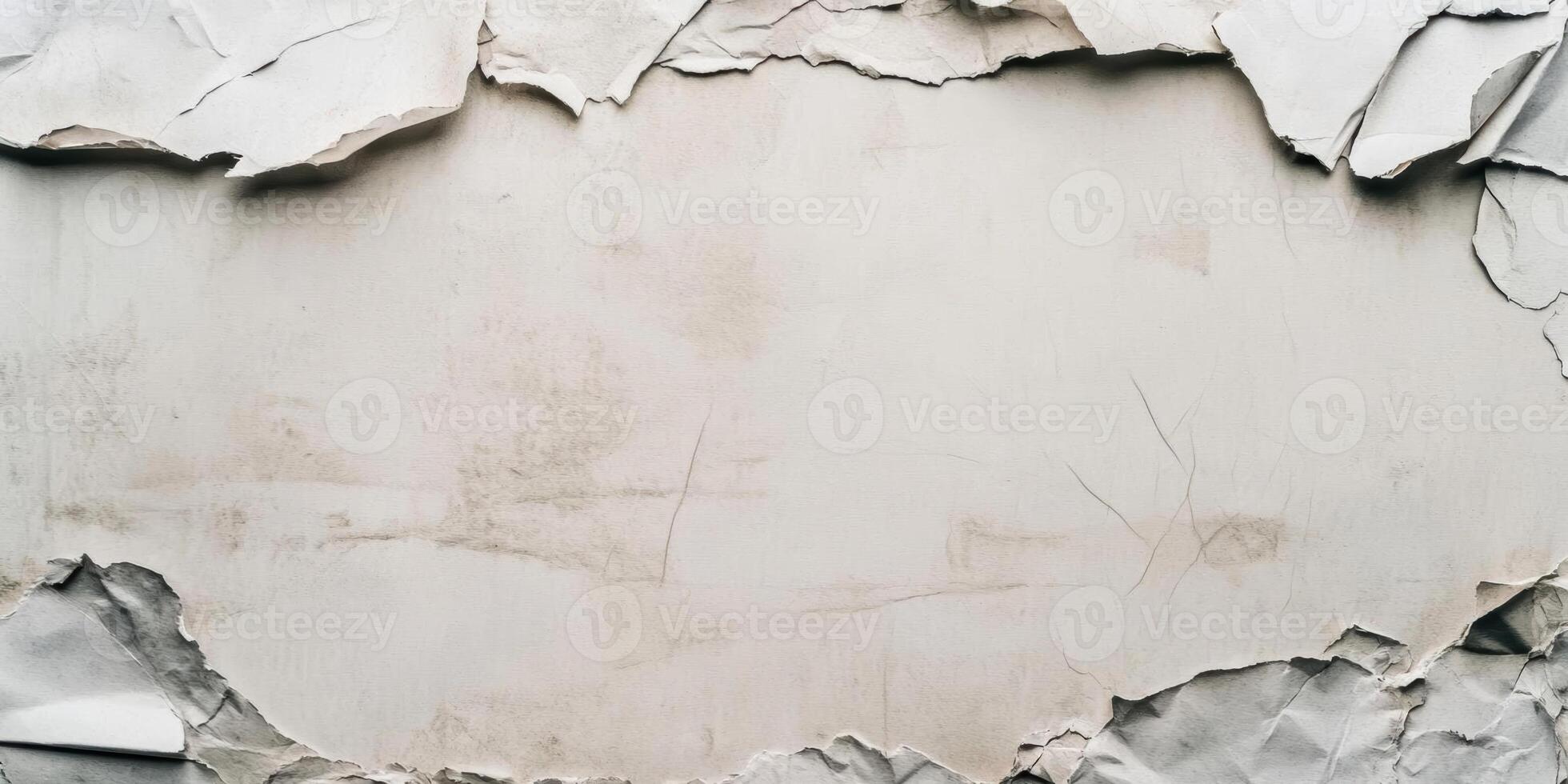 A white wall with torn paper and a hole photo