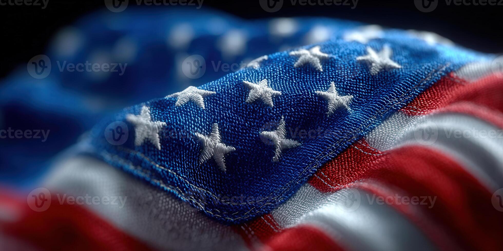 The american flag is waving, showing its stars and stripes in great detail and texture. photo
