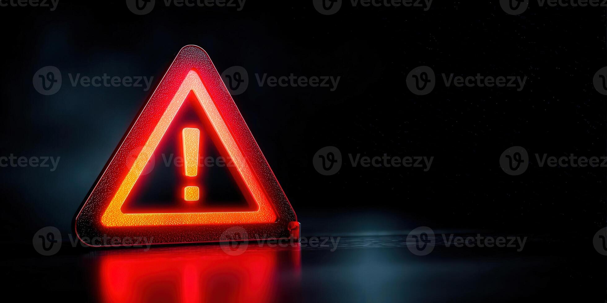 A glowing red warning sign with an exclamation mark against a dark background. photo