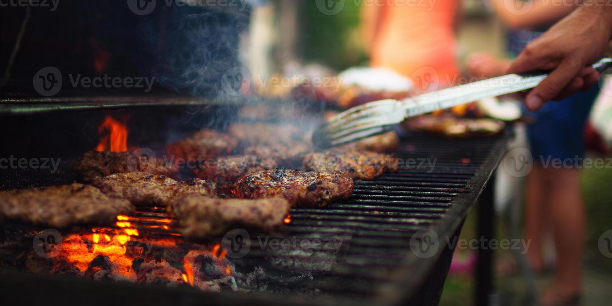 Juicy burgers sizzle on a hot grill, creating a perfect summer cookout scene. photo