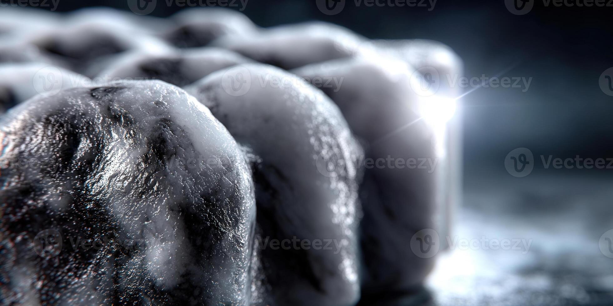 A close-up of textured ice blocks with a bright, sparkling light. photo