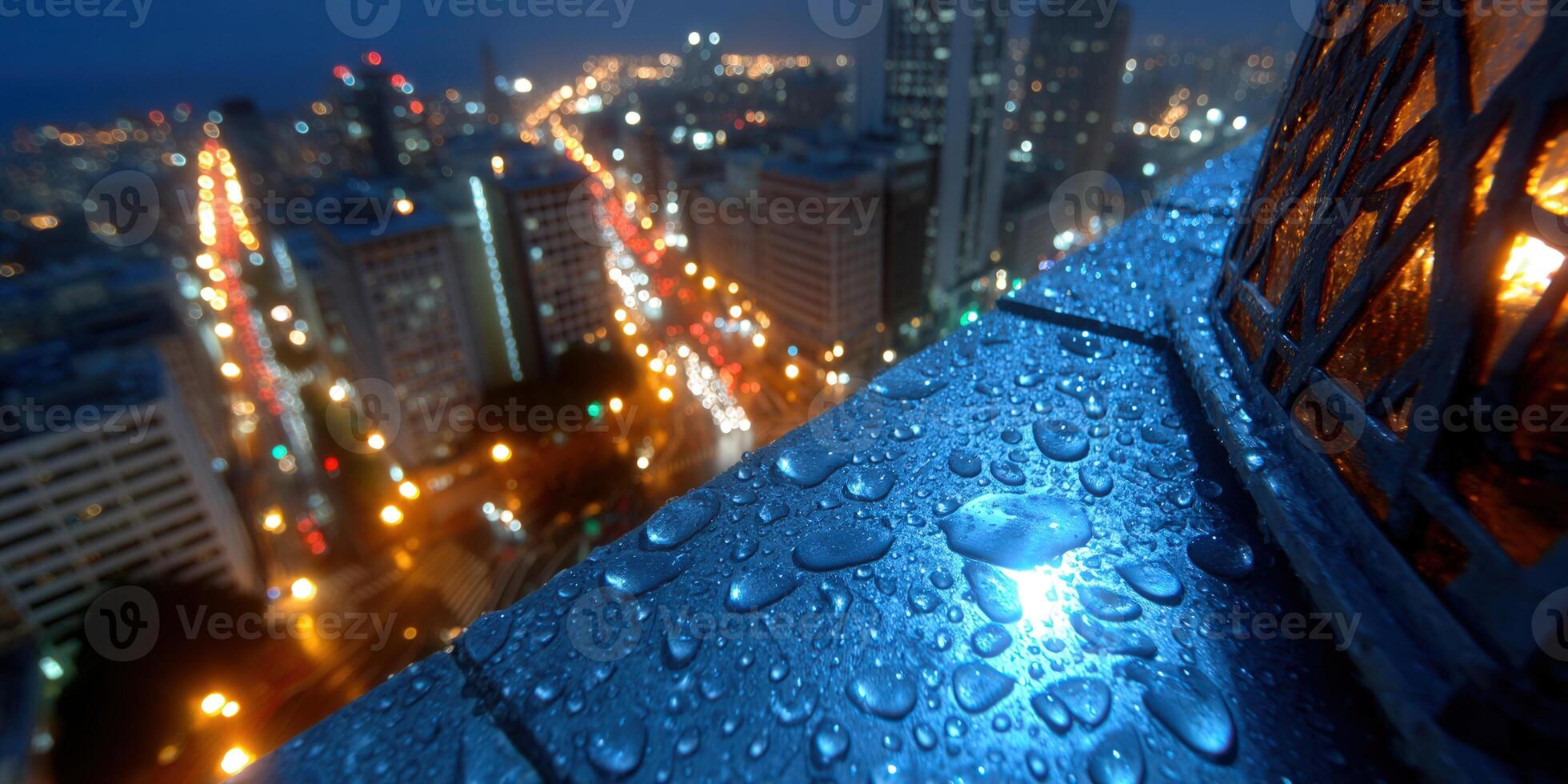 City lights glow through raindrops creating a beautiful nighttime urban scene. photo