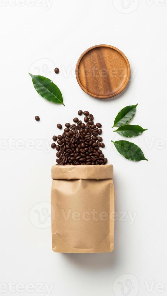 Coffee Beans Overflowing from Kraft Bag with Wooden Plate and Green Leaves on White Background photo