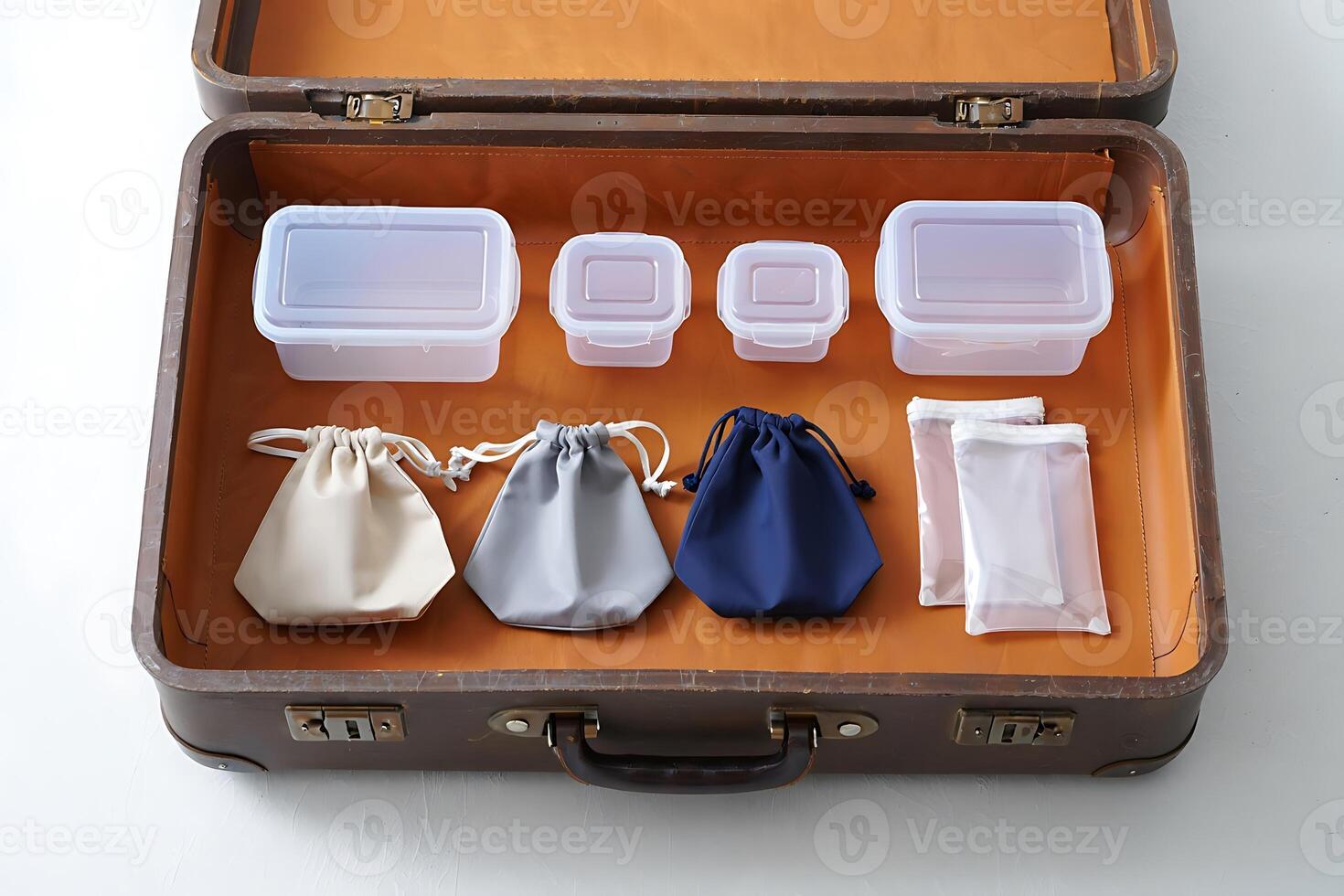 Organized Travel Essentials Containers and Pouches in Open Suitcase photo