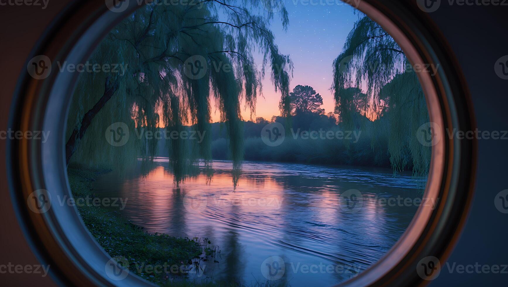 River View Through Round Window with Weeping Willows and Sunset photo