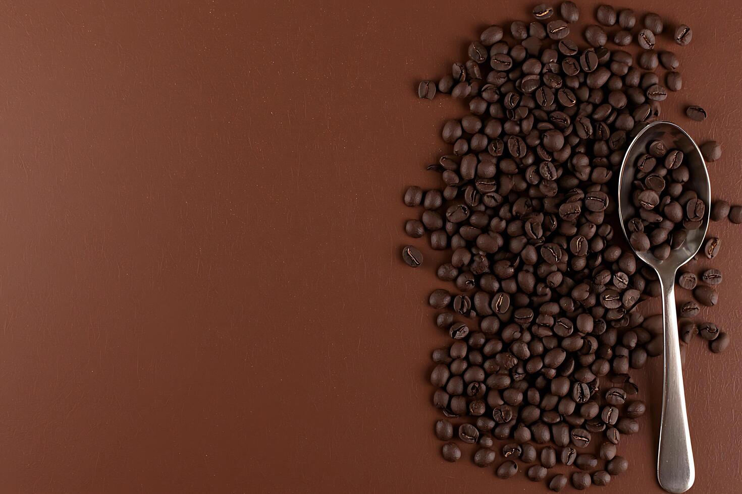 Roasted Coffee Beans with Spoon on Brown Background A Rich and Aromatic Image. photo
