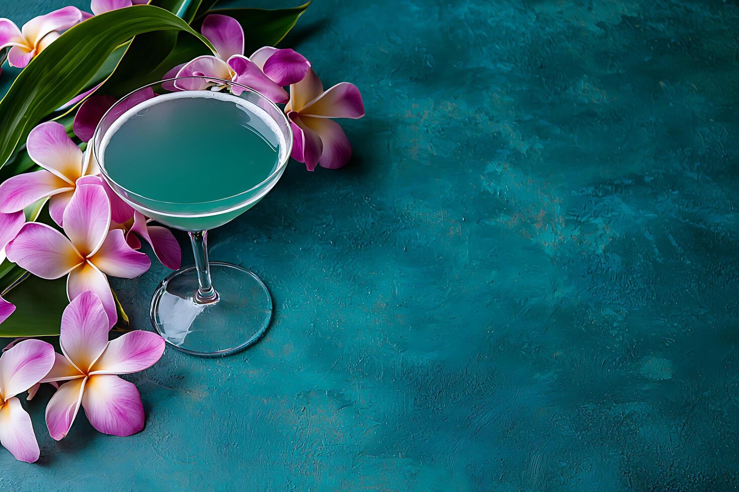 Teal Cocktail with Plumeria Flowers on a Textured Background. A refreshing summer drink image perfect for menus, blogs, and websites. photo