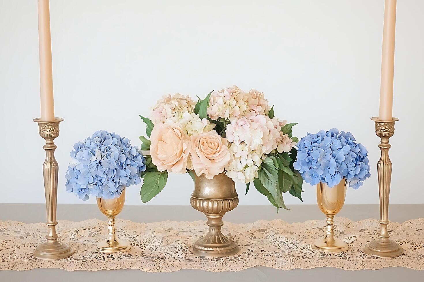 Elegant Table Setting with Gold Candle Holders, Hydrangeas, and Roses. photo