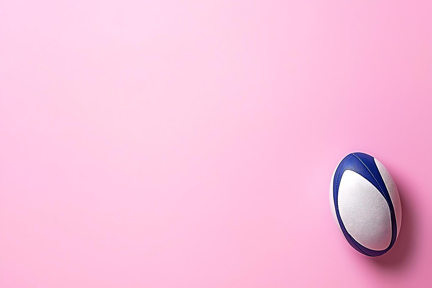 Rugby Ball on Pink Background Sport Equipment Photography. photo