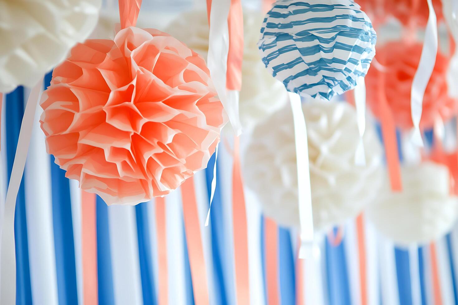 Festive Paper Decorations Hanging Against a Striped Background. Perfect for celebrations and party supplies. photo