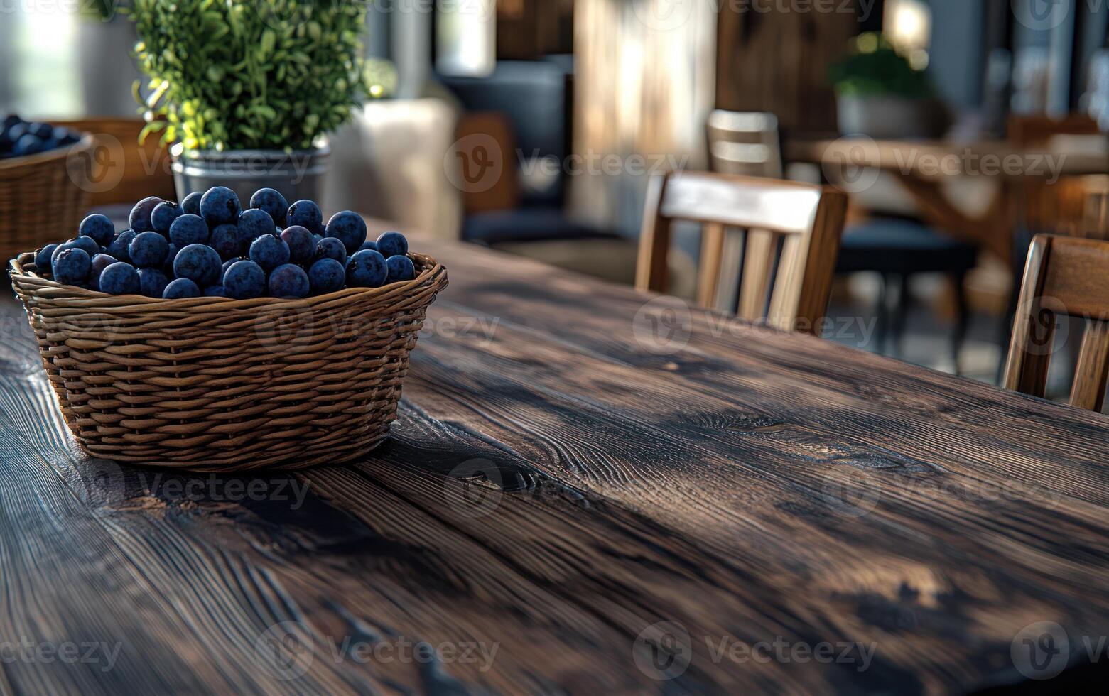 Dark wooden table with basket of berries in a room photo