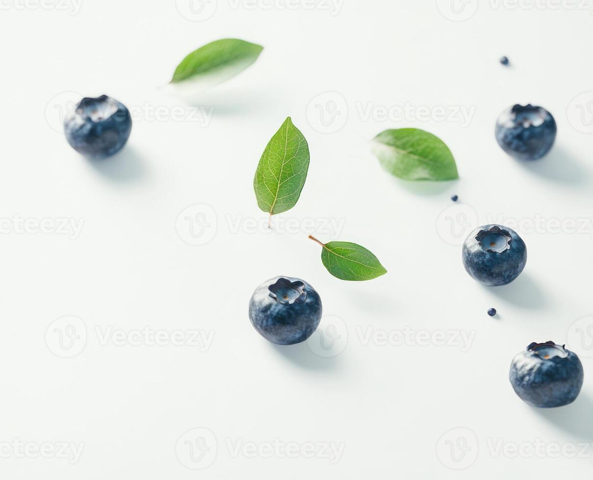 Fresh blueberries and leaves on white background photo