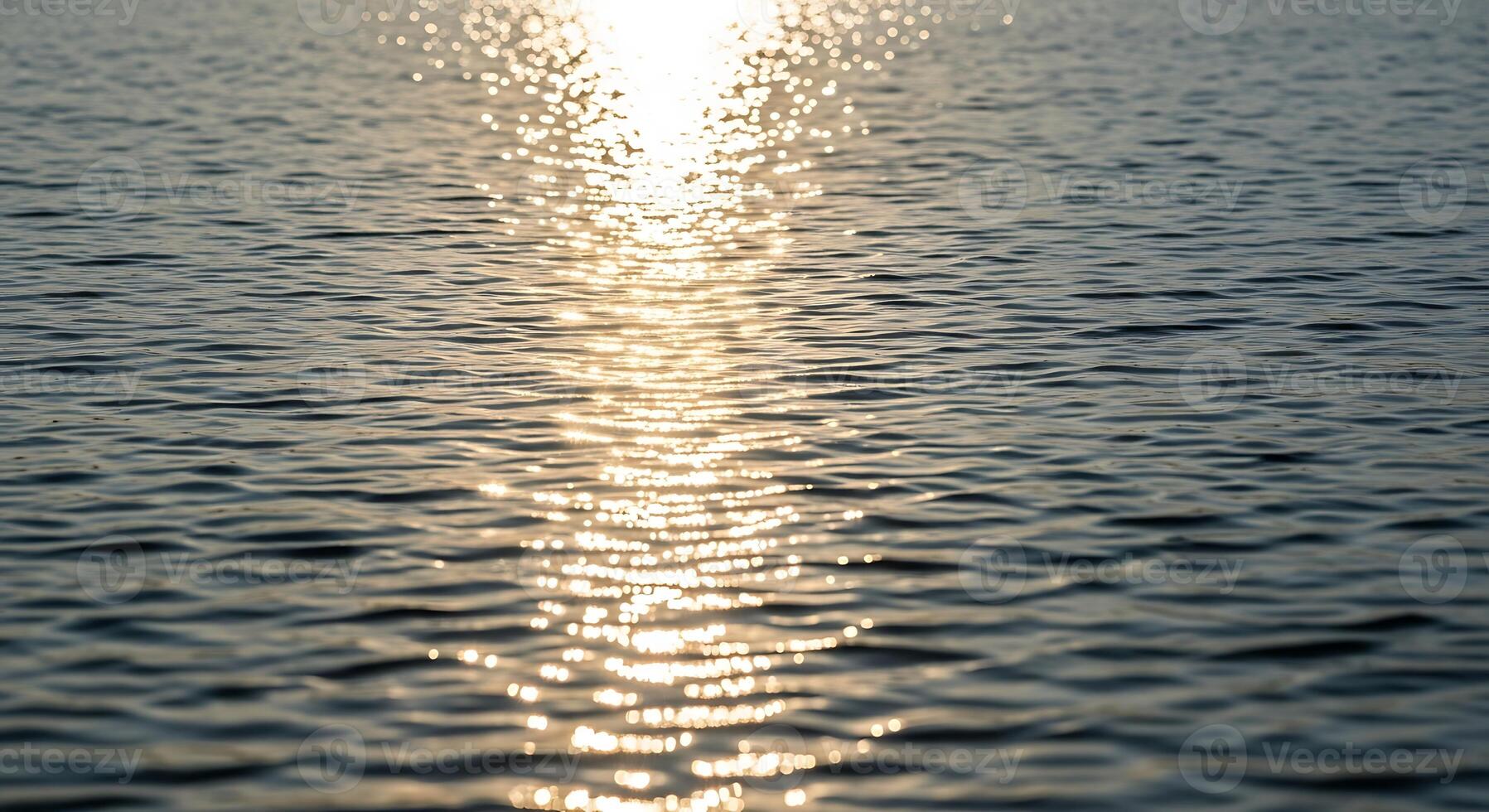 The sun is shining over the water photo