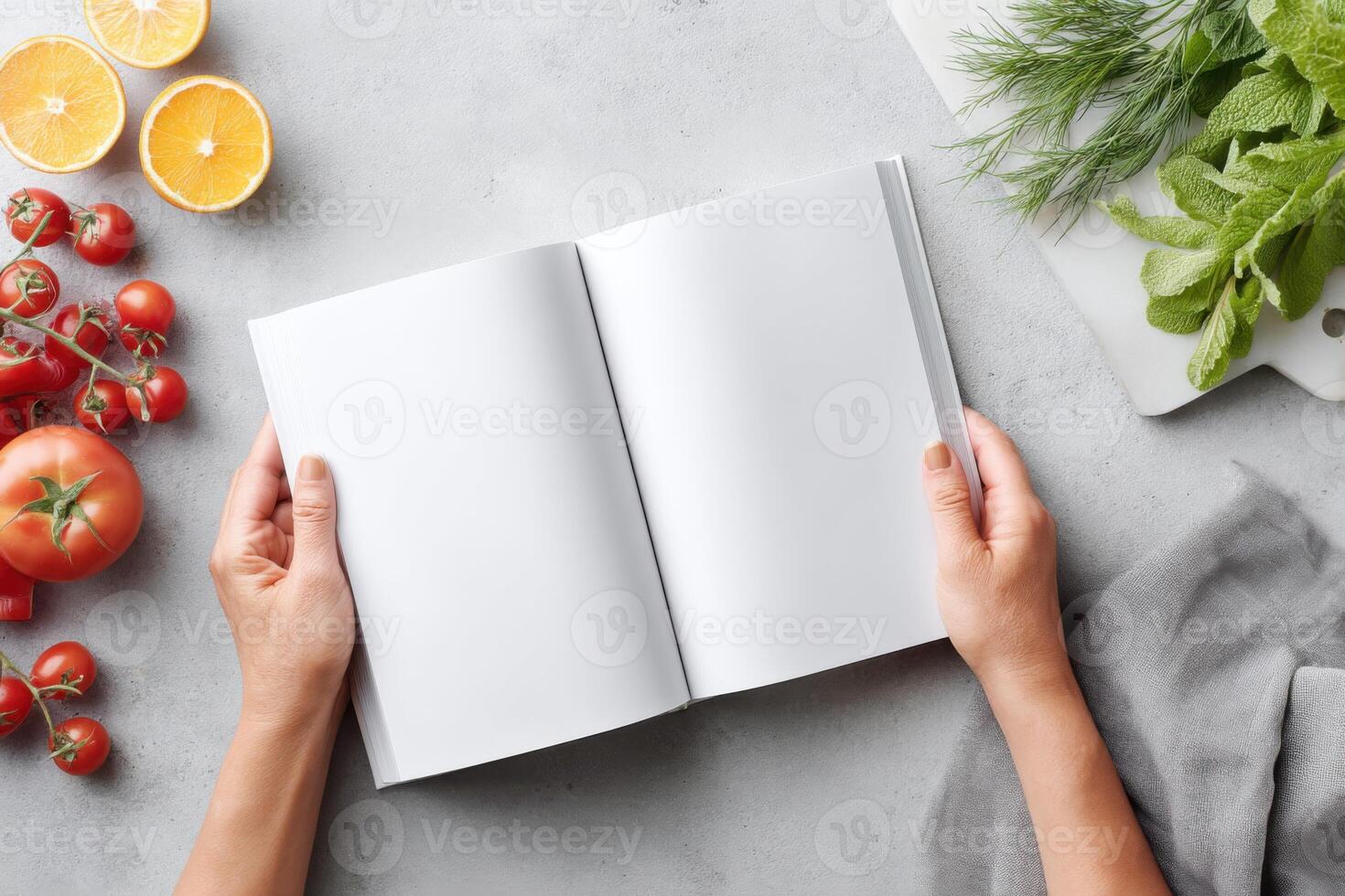 Showcasing a modern cookbook with hands, fresh ingredients and colorful backdrop photo