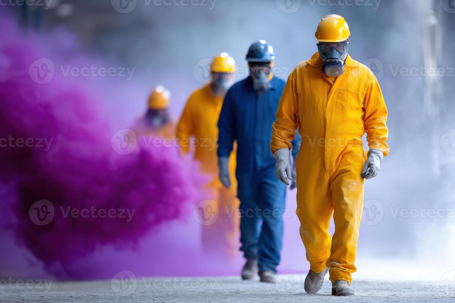 Diverse workers in protective gear using abrasive blasting equipment in an industrial environment photo