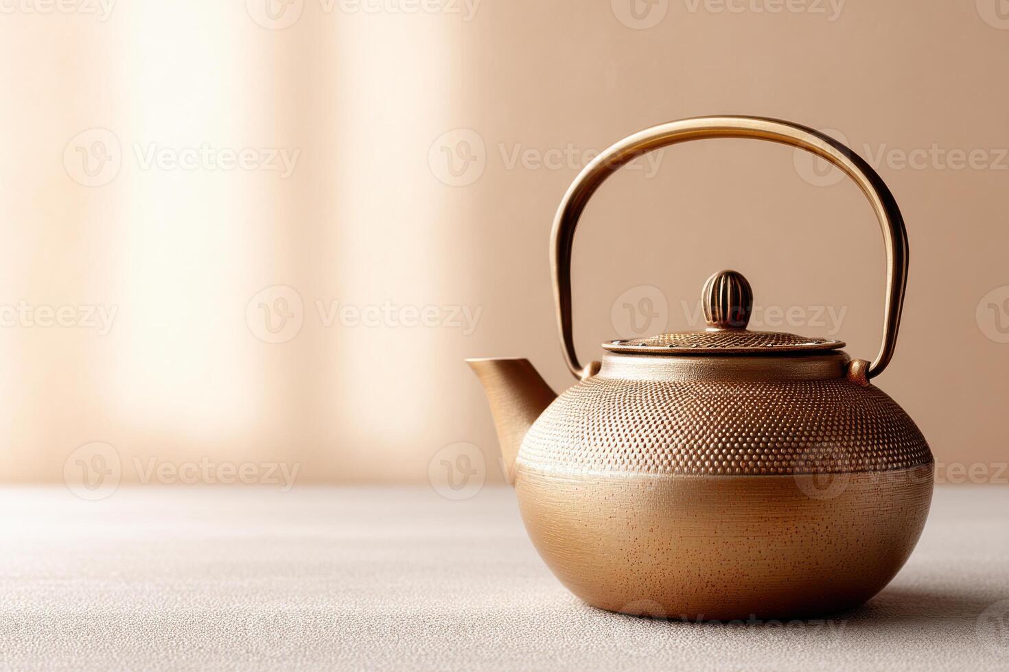 Beautifully textured teapot displayed elegantly against a bright background with ample copy space photo