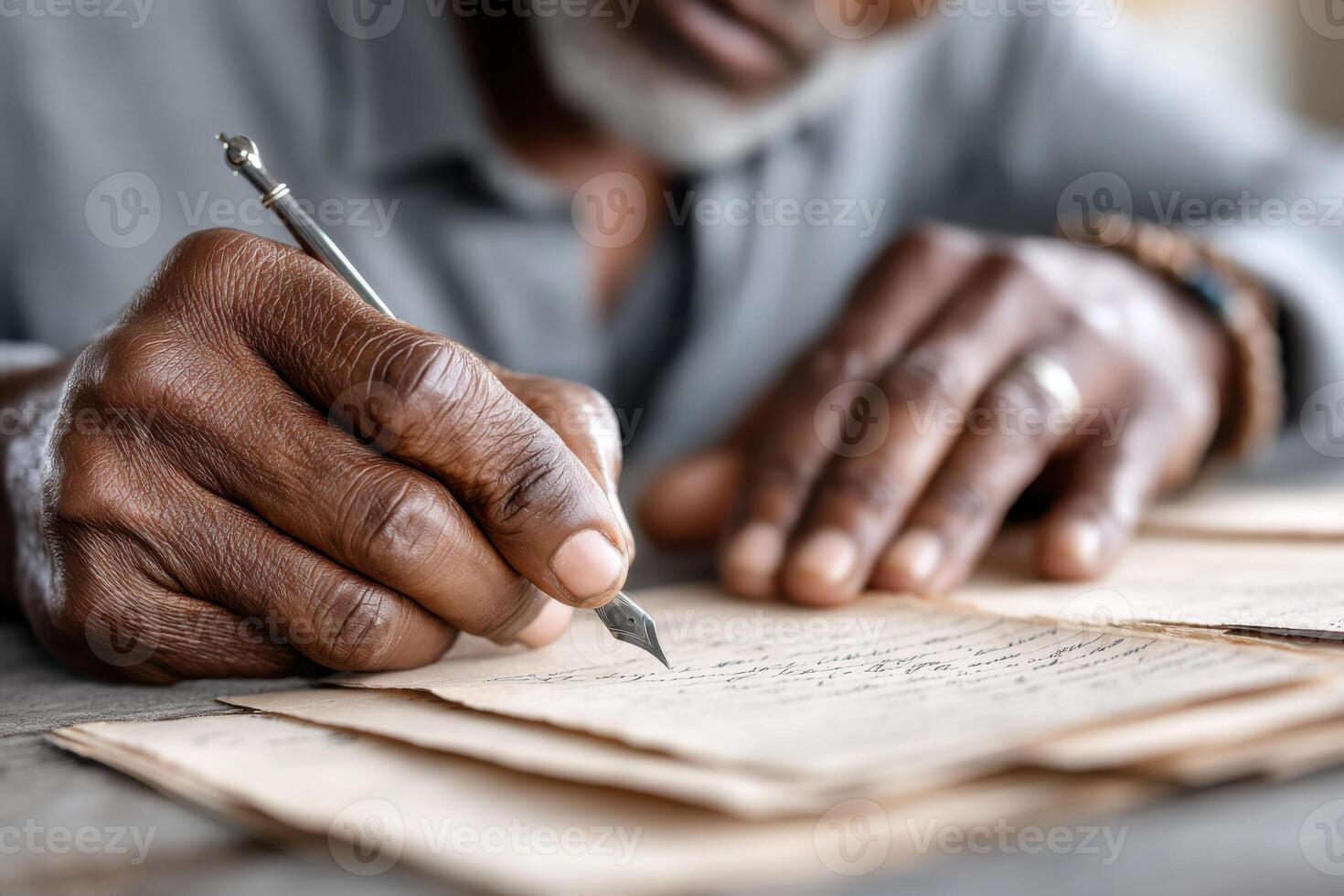 Close-up of hands organizing family history documents from multiple generations with attention to detail photo