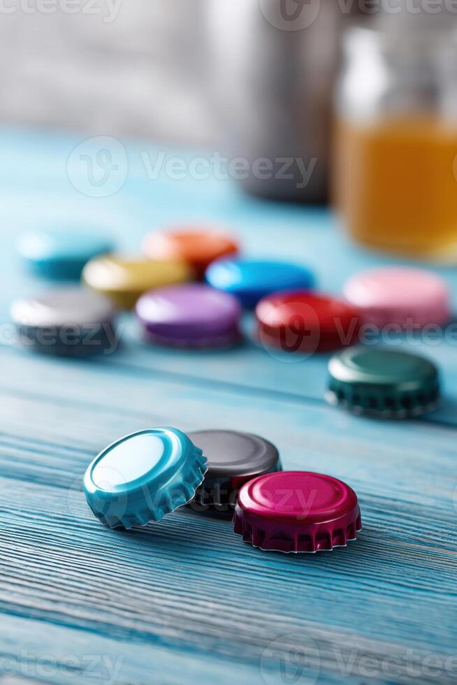 Colorful bottle caps create a cheerful vibe on blue wooden table photo