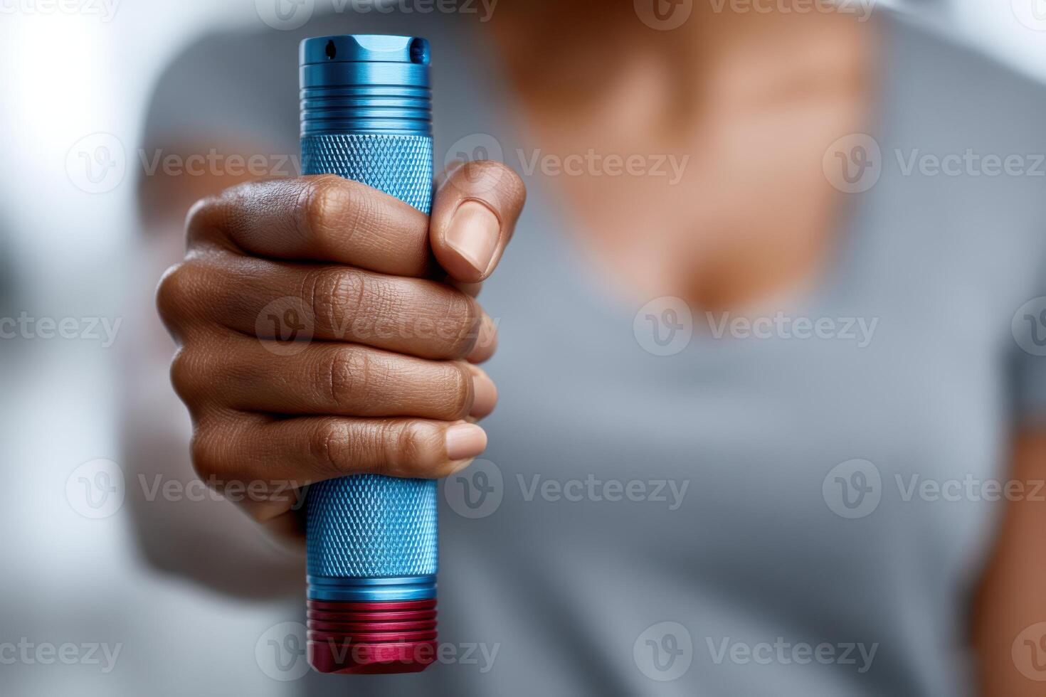 Close-up of hands gripping a colorful self-defense tool, showcasing confidence and preparedness for personal safety photo