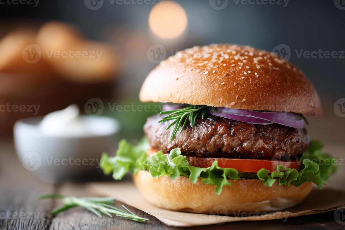 Juicy bison burger with fresh vegetables served on a rustic table in a cozy setting photo