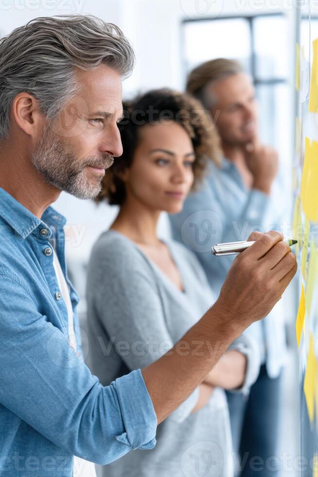 Diverse team collaborating on innovative process improvements in bright conference room photo