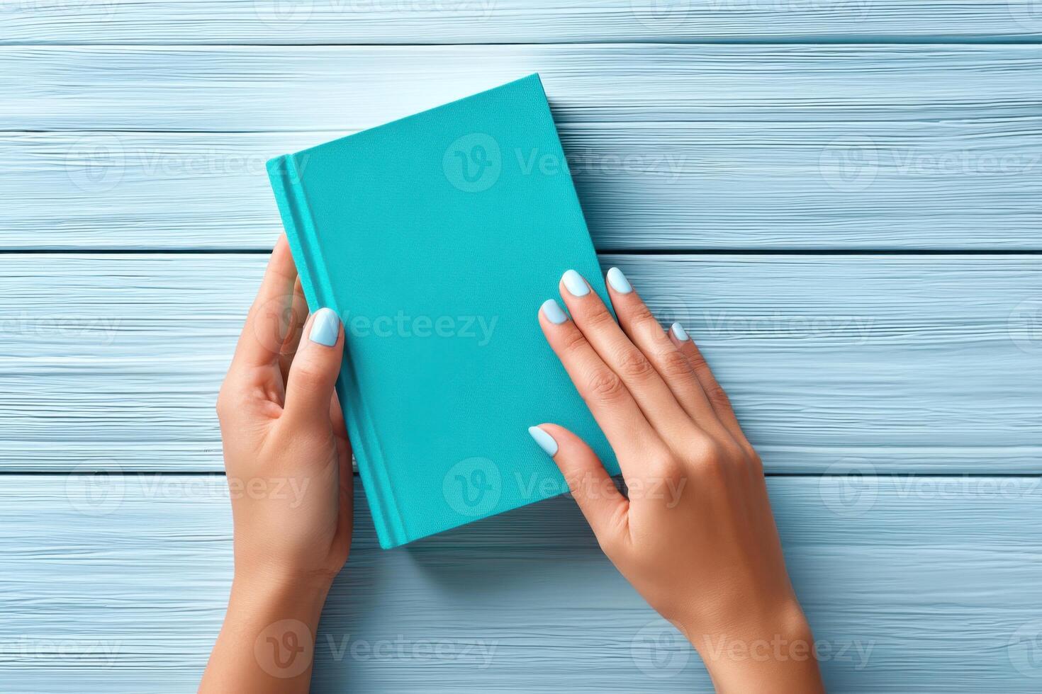 Vibrant textbook held in hands against a colorful backdrop with ample space for copy photo