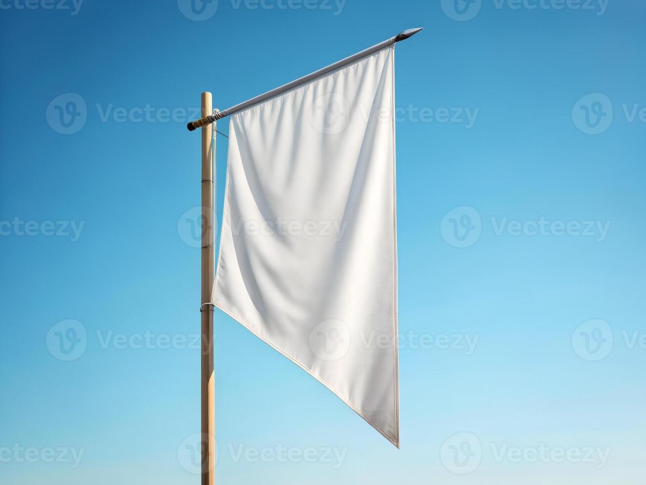 White Blank Pennant on Wooden Pole Against Blue Sky photo