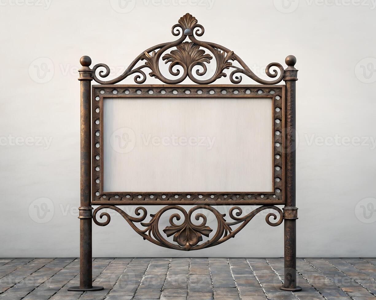 Blank Ornate Metal Sign with Floral Frame Against a Stone Wall photo