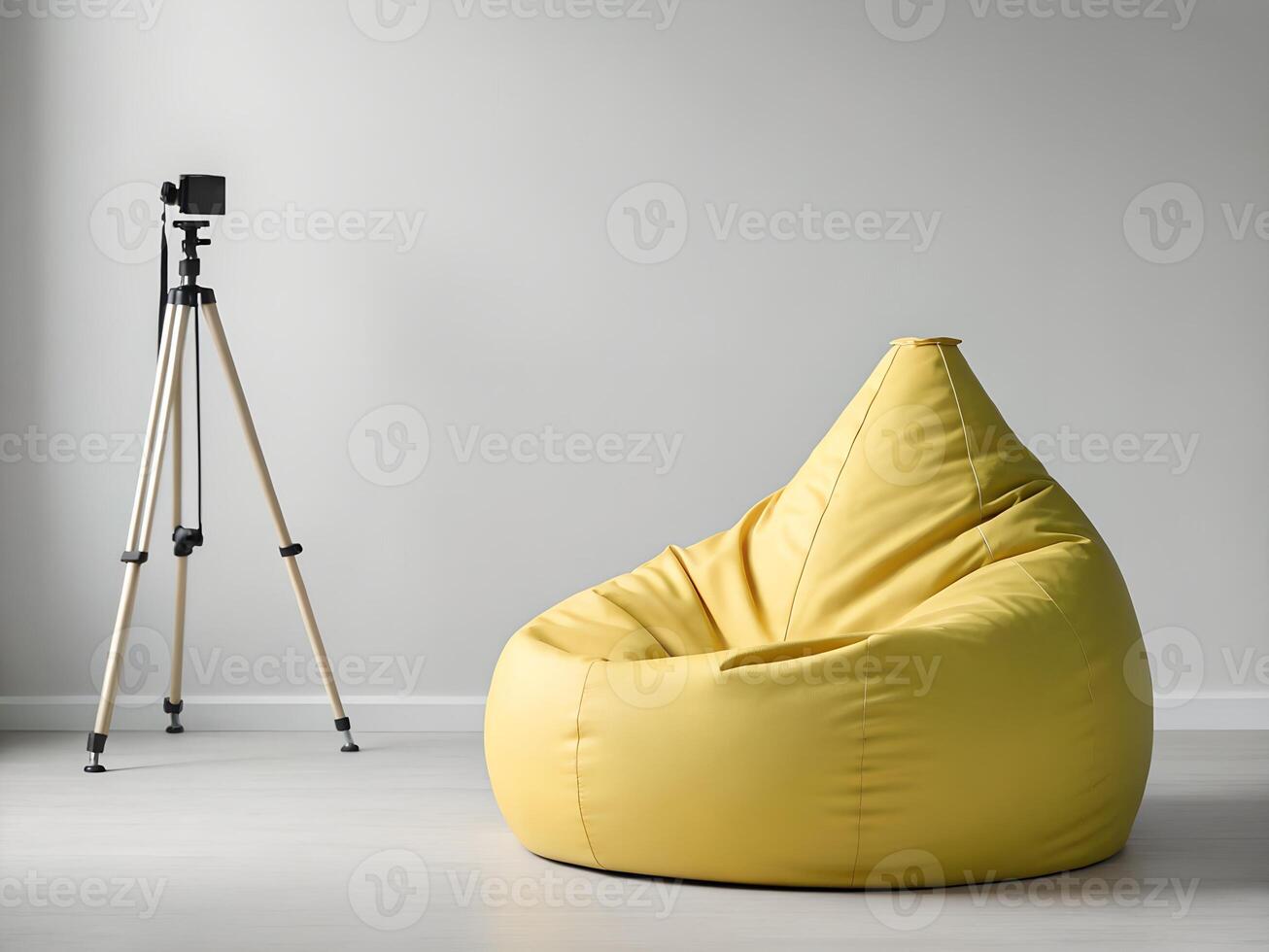 Yellow Beanbag Chair in Minimalist Studio Setting with Camera on Tripod photo