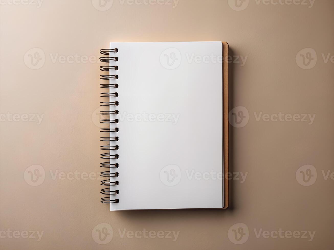 a notebook with a blank page on a beige background photo