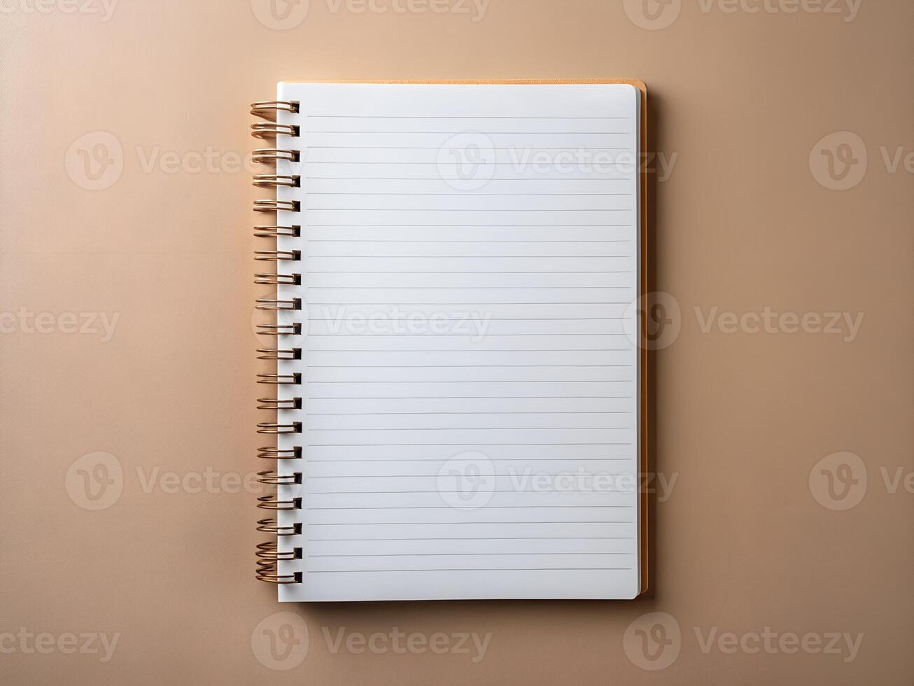 open notebook with a blank page on a beige background photo