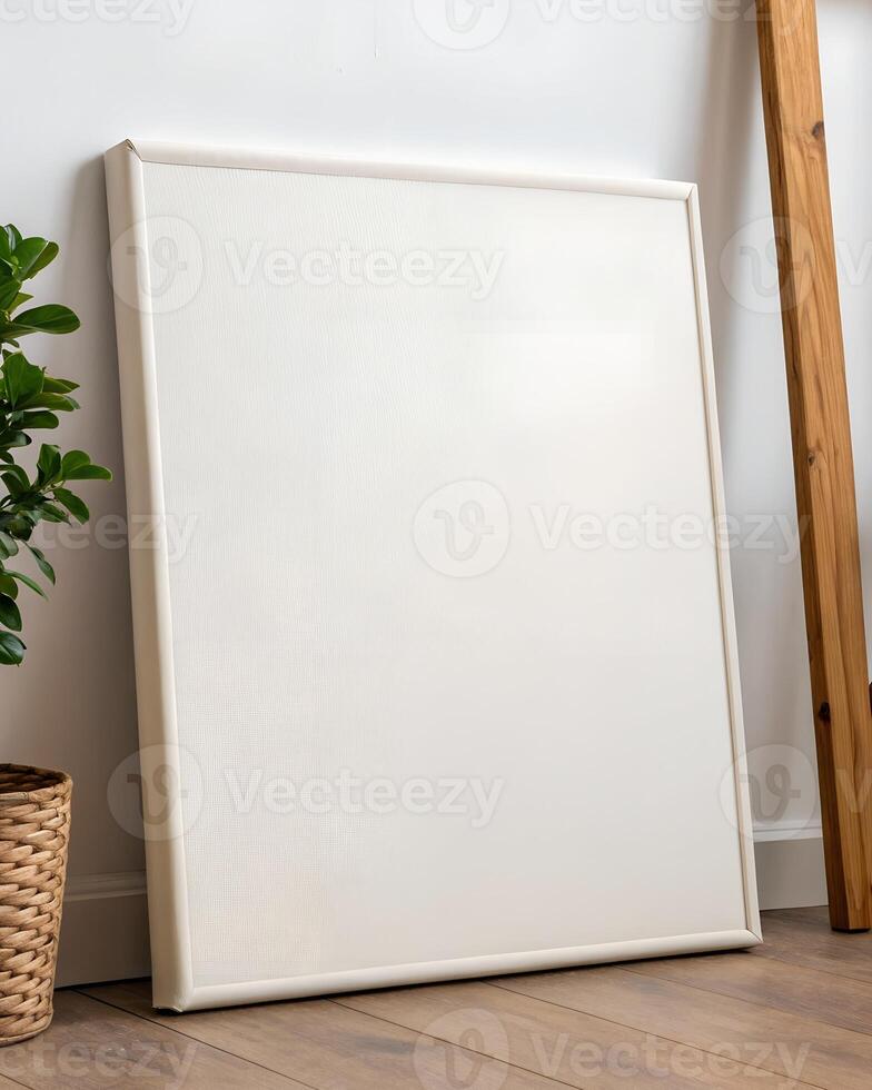 Off White Textured Canvas in White Frame Against White Wall photo
