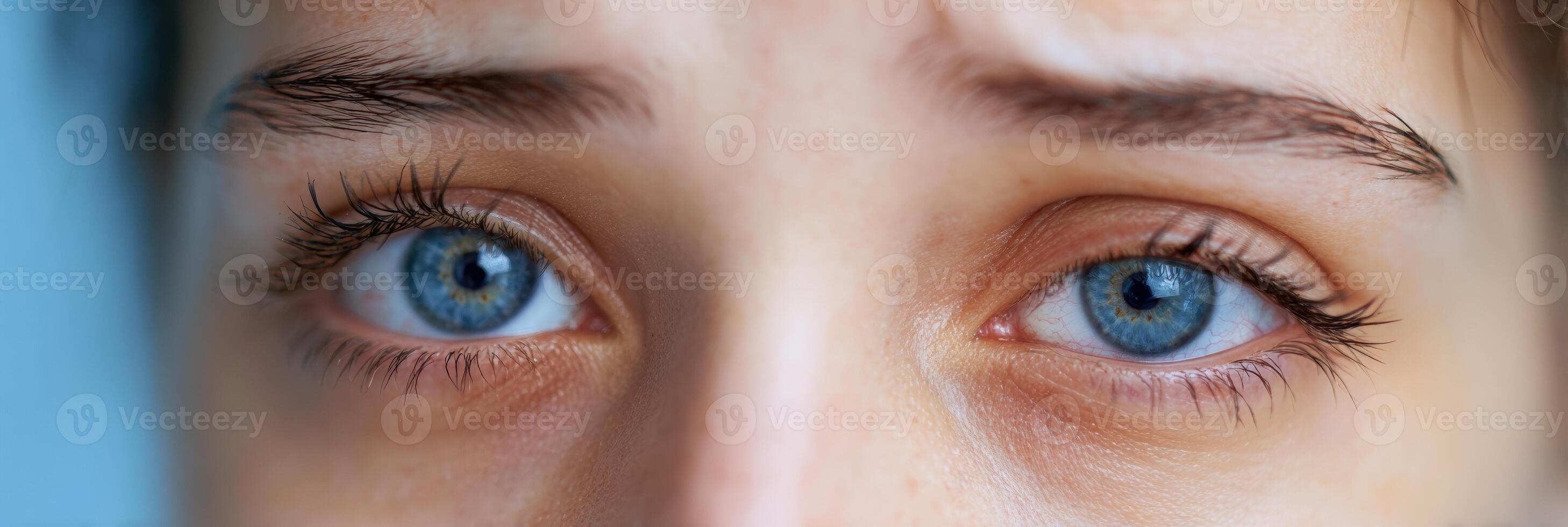 Eyes Exhibiting Twitching From Insomnia Against a Soft Blue Background During Late Night Hours photo