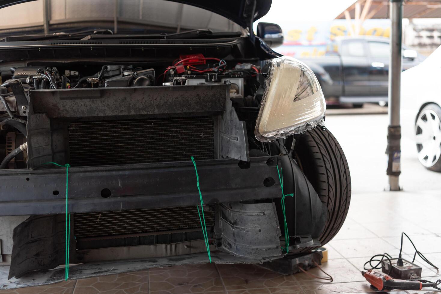 A car with a broken front end photo